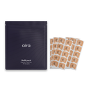 The aira refill pack of 30 magnetic nasal tab pairs, beside sheets of adhesive tabs.